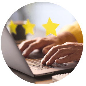 person typing on keyboard with stars above hands