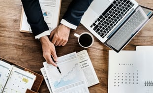 Business-man-Reviewing-Data-on-Desk